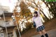 A young woman in a school uniform posing for a picture.